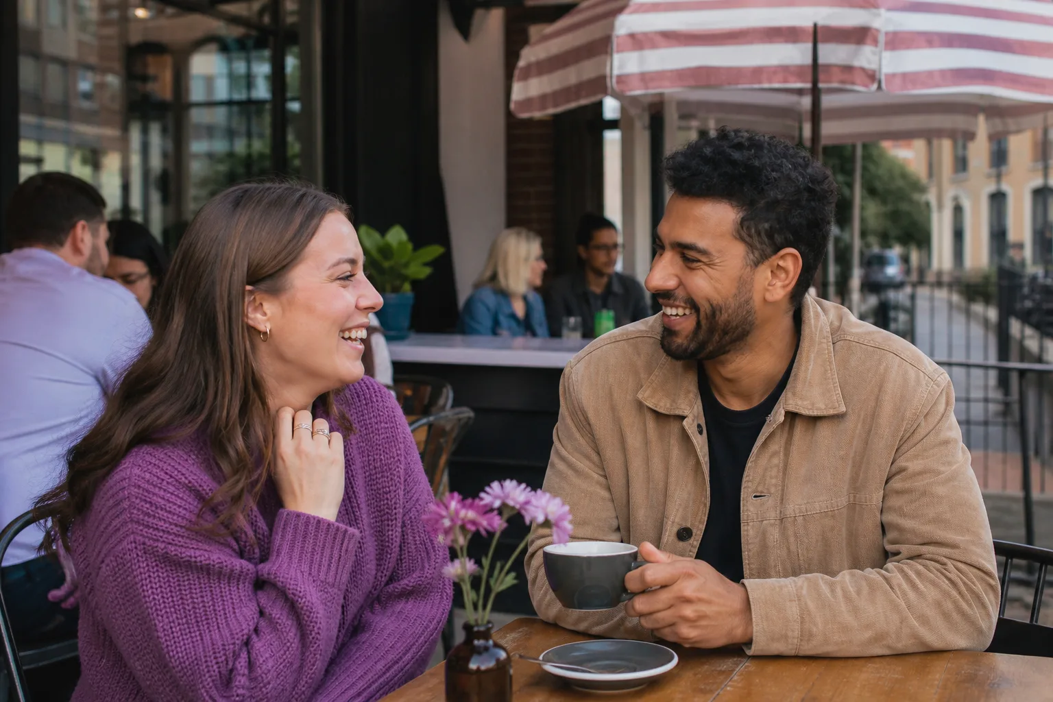 Two people chatting over coffee beside the River Thames in Berkshire